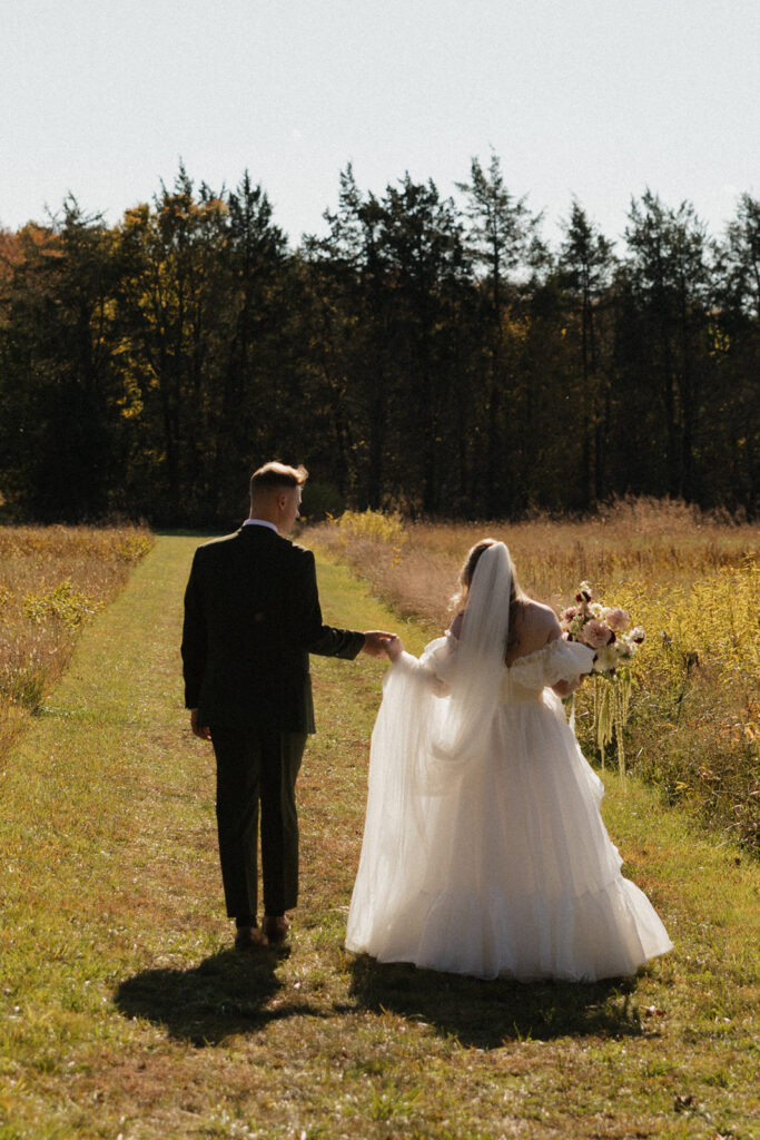 Candid photo of bride and groom walking