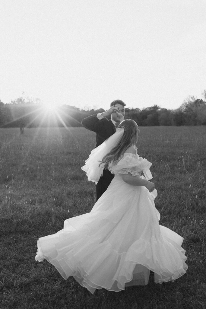 candid photo of bride and groom dancing